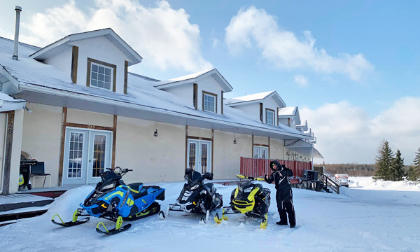 Snowmobiles in front of Inn